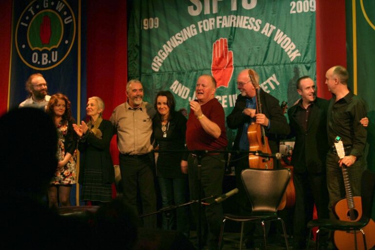 7.12.09. Dublin, Ireland. SIPTU Centenary Concert, Liberty Hall. CHRISTY MOORE performing with among others Karen Casey, Niall Vallely, Jinx Lennon, Paula Flynn, Brendan Devereux, Eric Fleming, Paula Meehan and Theo Dorgan. Â©Photo by Derek Speirs